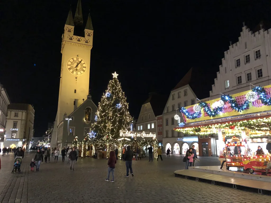 Christmas market with illuminated town tower