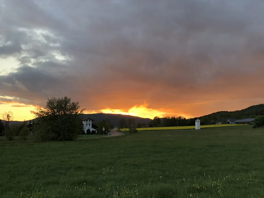 Sunset over meadows and hills