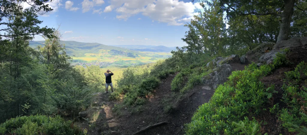 Wide view from a mountain path into the valley