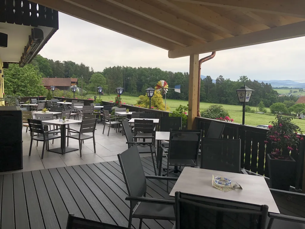 Covered terrace with a view over meadows and forests