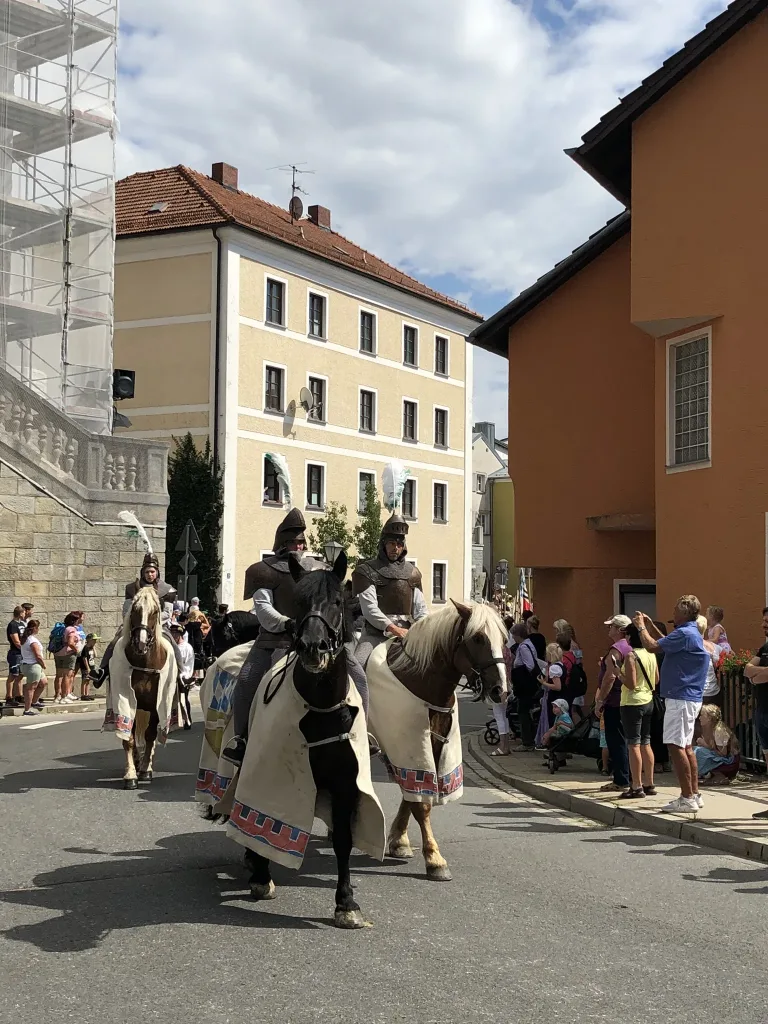 Riders in historical costume in the festival parade